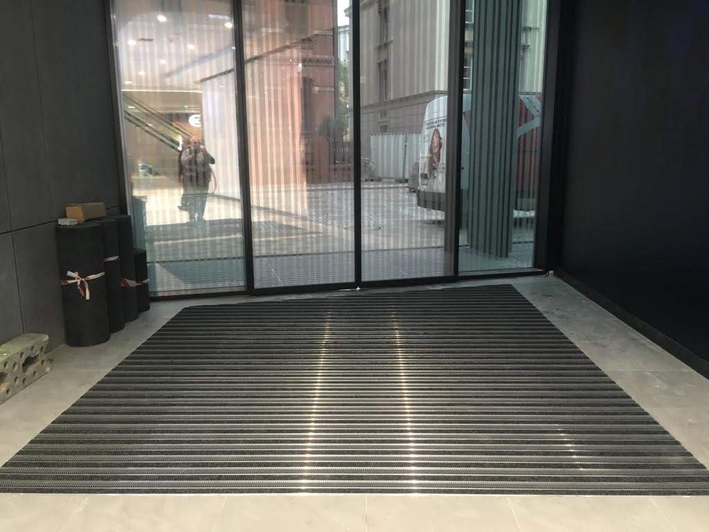 Entrance mats with ribbed carpet.